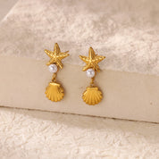 Exquisitos pendientes de estrella de mar de concha para mujer, pendientes de gota chapados en oro con perlas de imitación, joyería de acero inoxidable para fiesta 2025