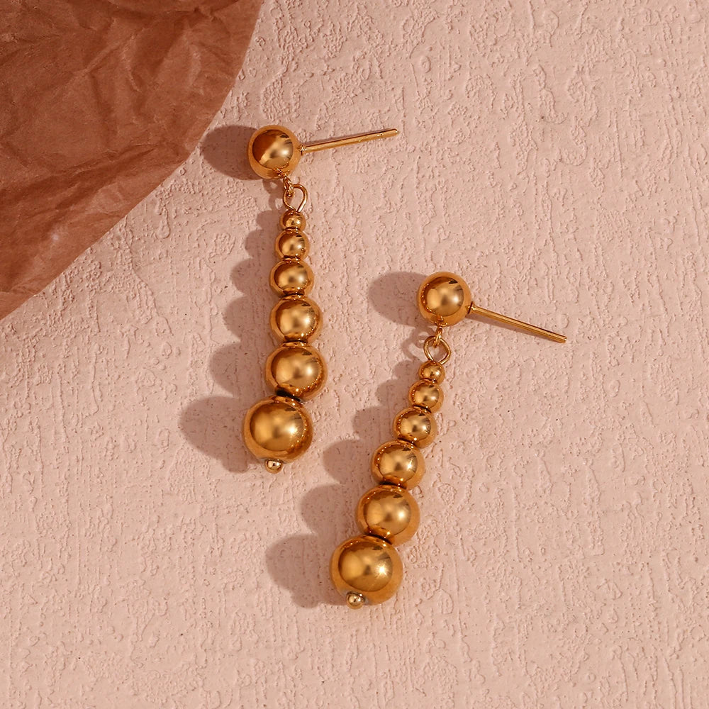 Pendientes de esfera larga