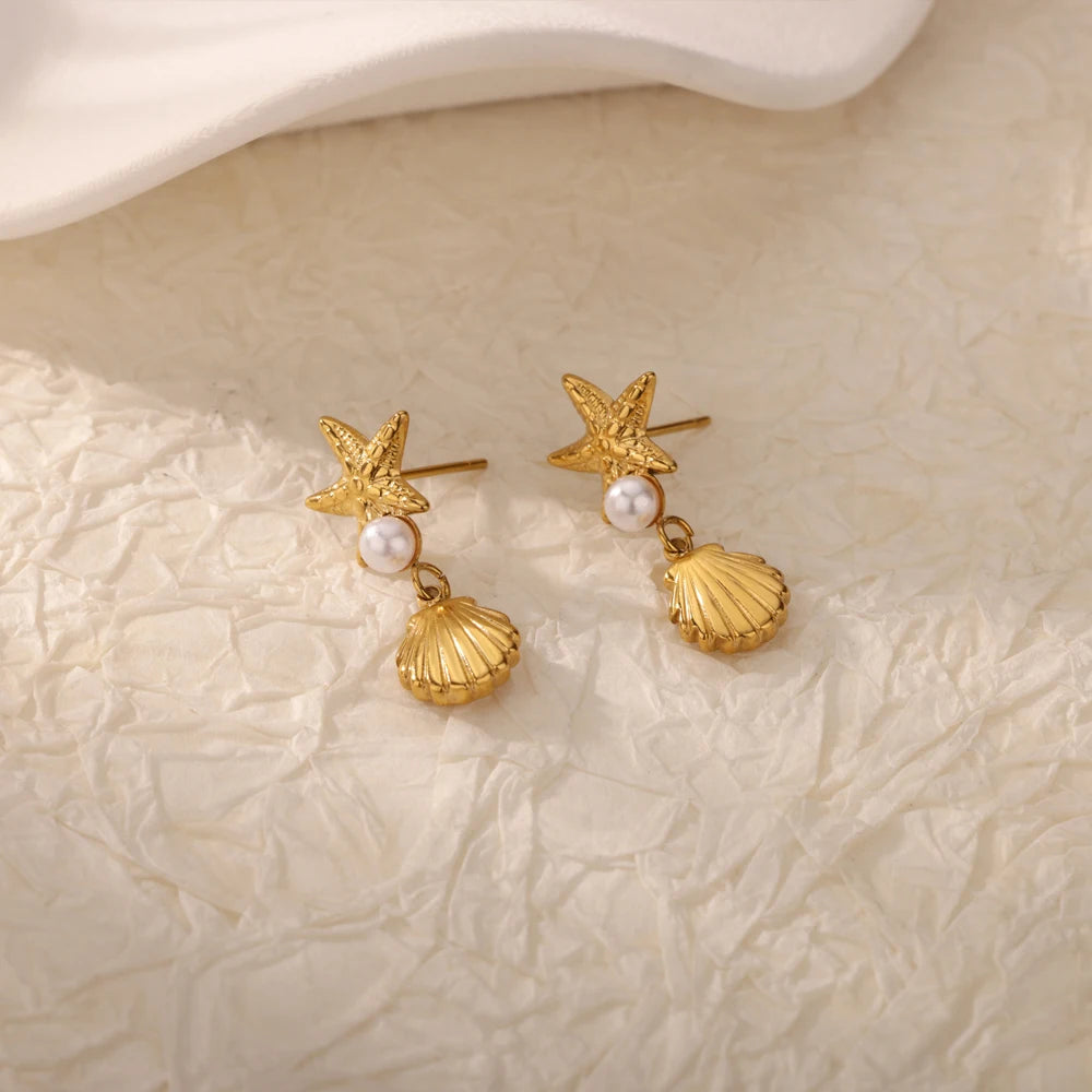 Exquisitos pendientes de estrella de mar de concha para mujer, pendientes de gota chapados en oro con perlas de imitación, joyería de acero inoxidable para fiesta 2025