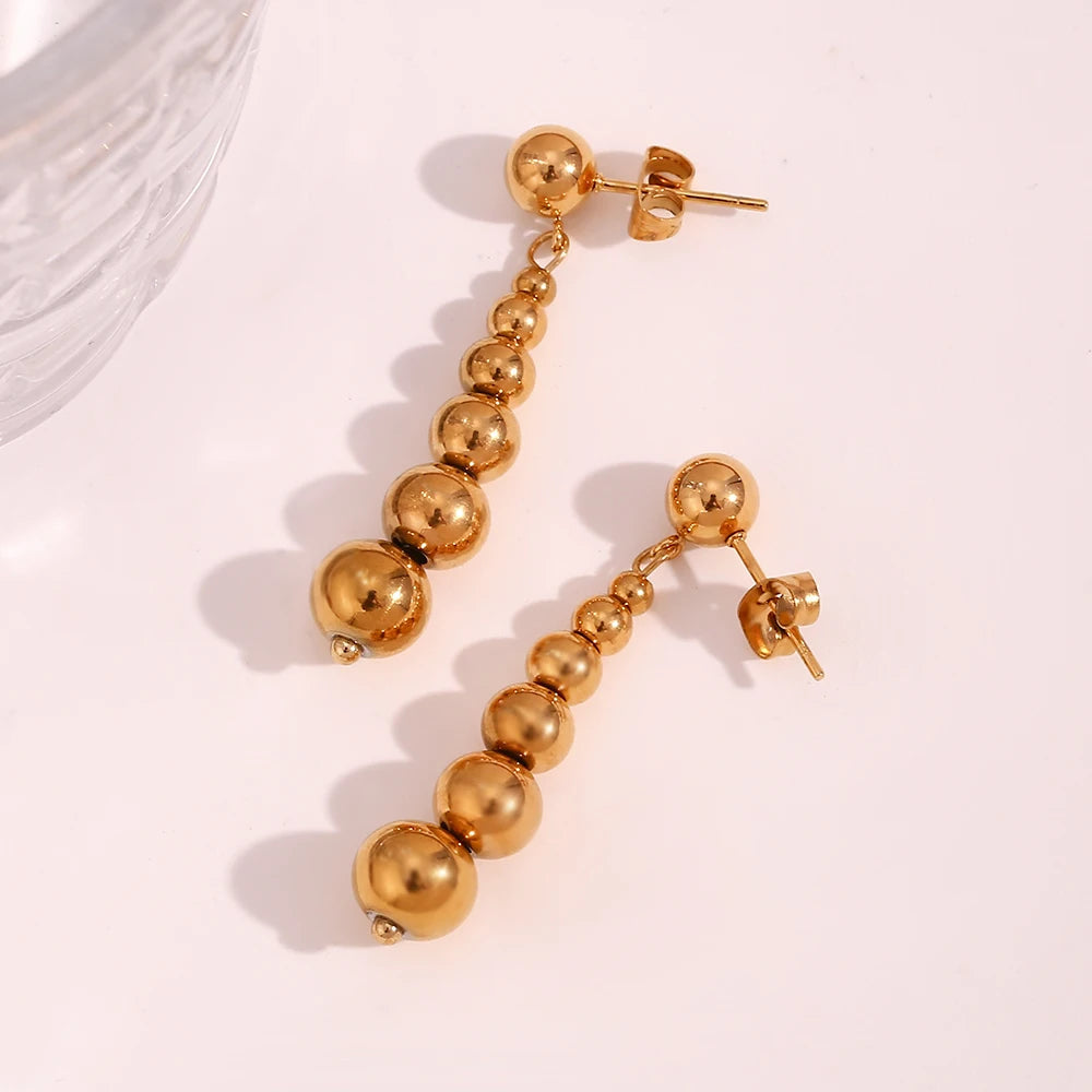 Pendientes de esfera larga